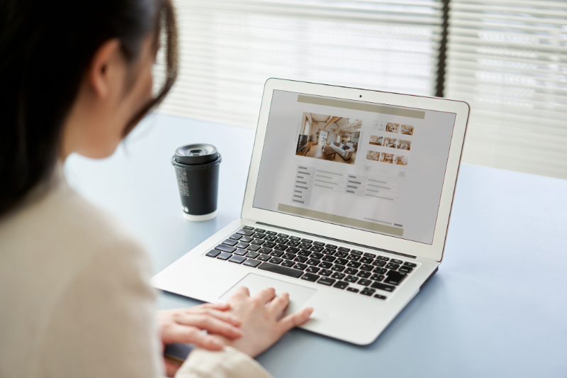 woman scrolling on laptop