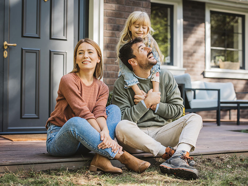 Young Family Enjoying in Sunny Day